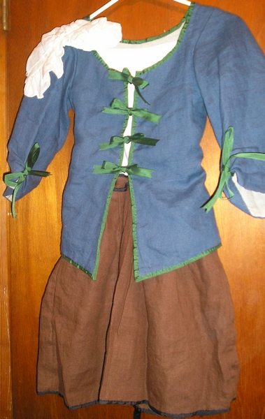 girl's cap, juste-au-corps or jacket and skirt or jupe with ferreted hem